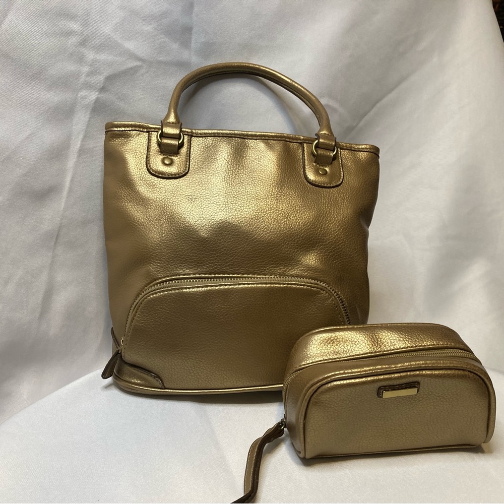 Relativity gold top handle bag with matching clutch. Such a cool little bag.
